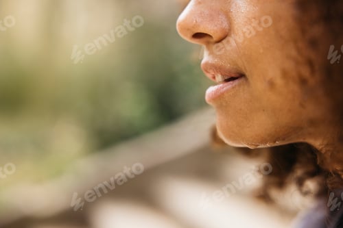 Preview: Close-up of a woman with sweat after exercising outdoors