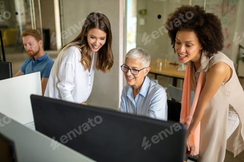 Preview: Group of programmer working in a software developing company office