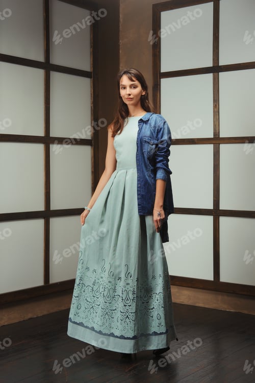Preview: Pretty model demonstrating outfit - long cotton dress and jeans jacket