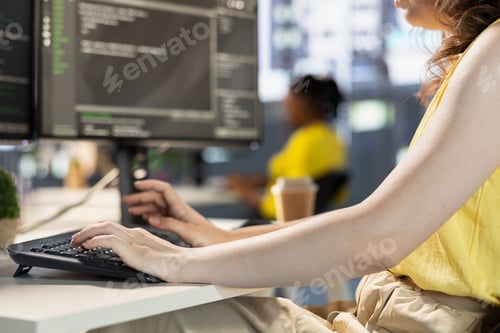 Preview: Programmer typing on computer, conducting tests to optimize machine learning