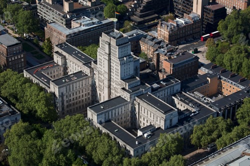 Preview: Aerial view of an urban landscape with tall buildings and lush greenery