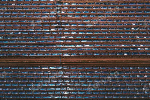 Preview: Top down aerial shot of watermelon plantation with plastic sheeting hothouse equipment