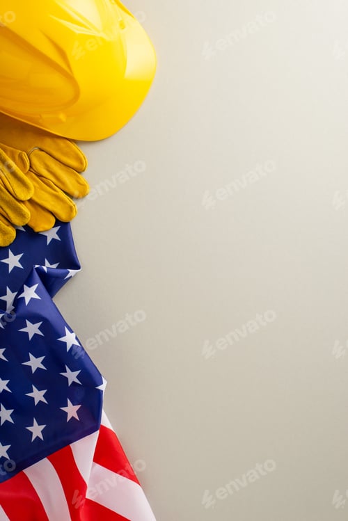 Preview: Honoring construction workers on Labor Day: appealing top-view vertical photograph of american flag