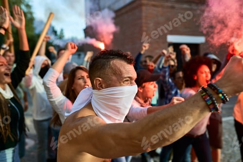 Preview: Angry crowd of people with inflamed torches on public demonstrations.