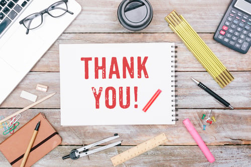 Preview: Thank you written on notebook at office desk