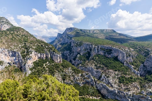 Preview: panoramic view of majestic rocky mountains with green vegetation in provence, france