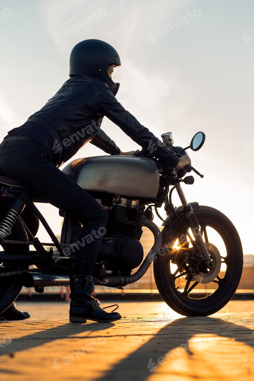 Preview: Biker girl on caferacer motorcycle.