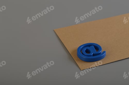 Preview: Brown envelope and email address symbol. Email marketing and email communication concept