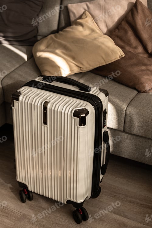 Preview: Hard-shell suitcase in modern living room, travel luggage ready for departure