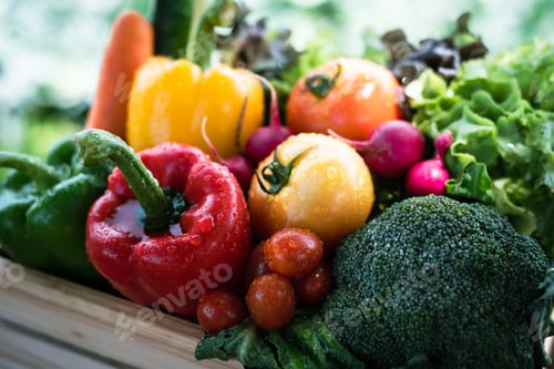 Preview: Crate filled with a large selection of healthy fresh organic fruits and vegetables.