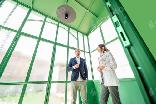 Preview: Business people in the green hall