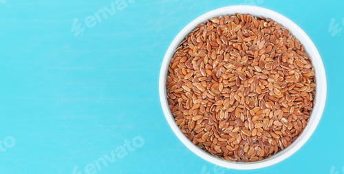 Preview: Organic flax seeds in a bowl, selective focus, space for text.