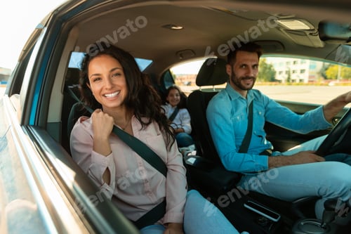 Preview: Family vehicle. happy family driving car enjoying first ride together, woman sitting in front