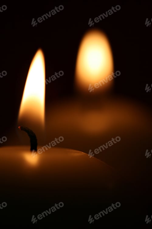 Preview: Warm candle light, closeup view in the dark room