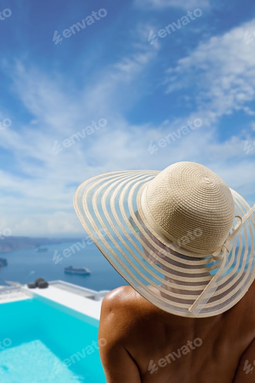 Preview: Woman at the swimming pool on the island of Santorini in Greece