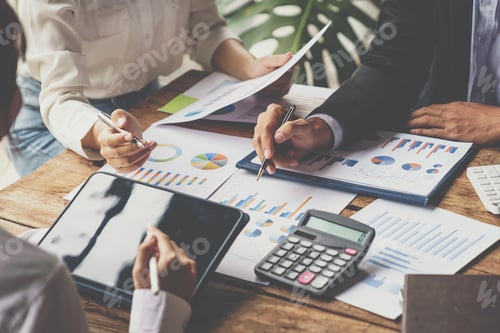 Preview: business people meeting in the office Calculate the tax and income of the company's investment. Stra