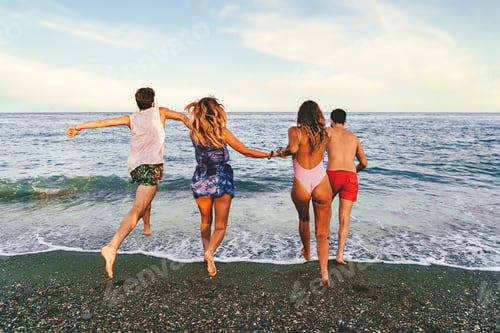Preview: Young Couples Running Towards the Calm Sea