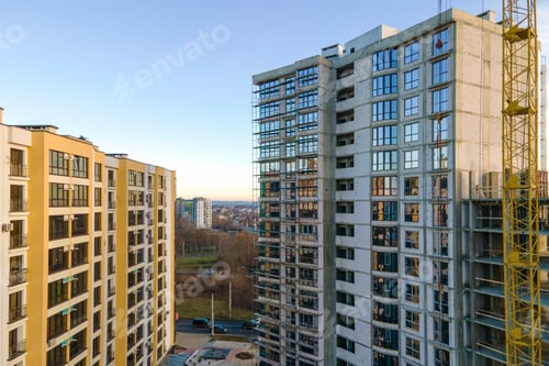 Preview: Aerial view of high residential apartment building under construction. Real estate development