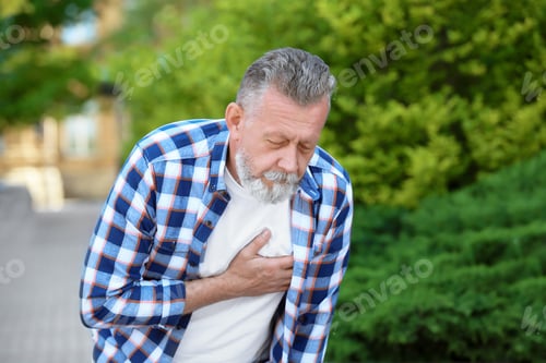 Preview: Mature man having heart attack, outdoors