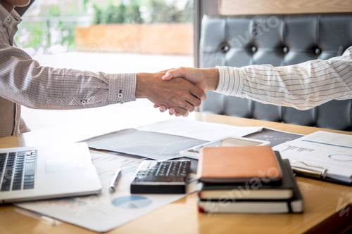 Preview: Business People Shaking Hands in Modern Office