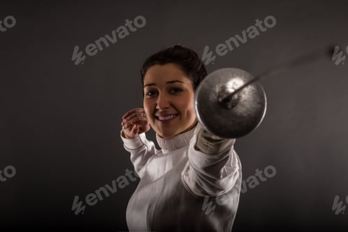 Preview: Portrait of woman wearing white fencing costume practicing with the sword.