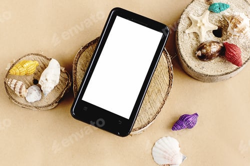 Preview: phone with empty screen and colorful shells on wooden craft background