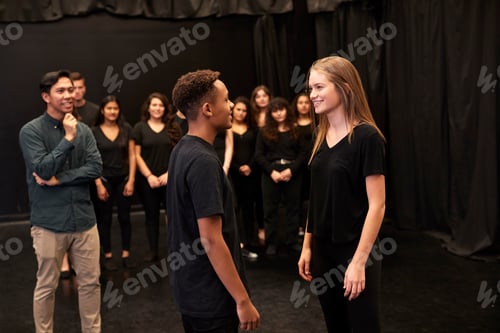 Preview: Teacher With Male And Female Drama Students At Performing Arts School In Studio Improvisation Class