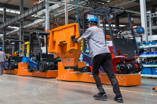 Preview: worker works at an engineering plant. Modern industrial photo