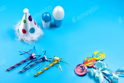 Preview: a front view colorful lollipops multicolroed candies along with decorations on the blue background