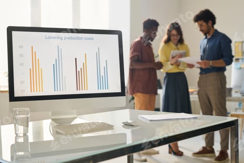Preview: Business people working with financial graphs in office