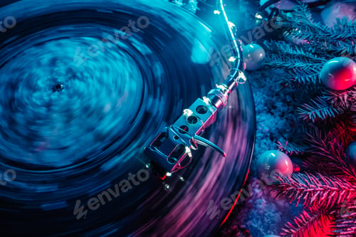 Preview: Classic vinyl record playing in snow, enchantment winter season.Nostalgic warmth