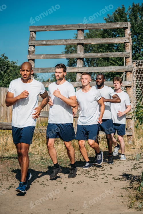 Preview: multicultural young soldiers running on range