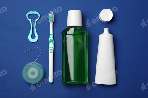 Preview: Flat lay composition with tongue cleaner and teeth care products on color background