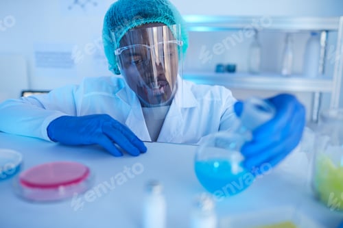 Preview: Man working with chemicals at lab