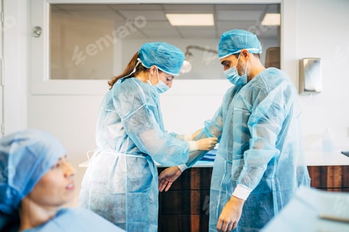 Preview: Dental surgeon prepares to perform an operation