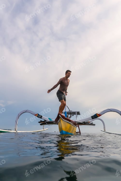 Preview: Man diving from boat in waving water