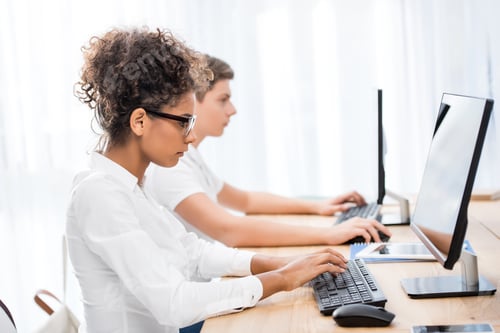 Preview: young teenager students working on computers