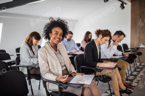 Preview: Portrait of a confident young woman taking assessment test.