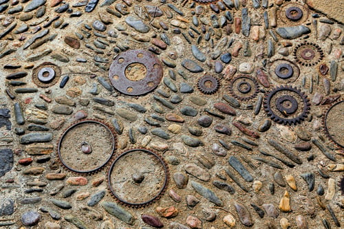 Preview: Unusual floor with pattern from pebbles and metal details