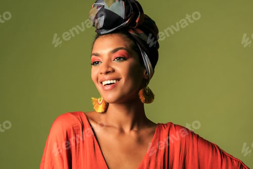 Preview: Beauty portrait ofStylish woman with colorful turban in studio.