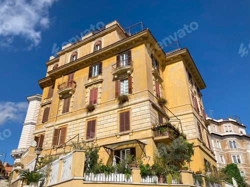 Preview: old historic building with green plants on balcony