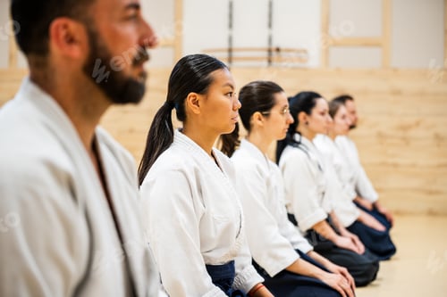 Preview: Young Woman Participates in Martial Arts Class With Practitioners in Training Session