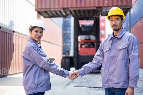 Preview: Portrait of an engineer inspecting products using a barcode scanner. Container import and logistic