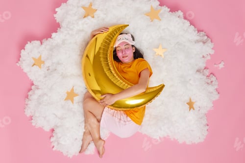 Preview: Sweet dreams concept. Relaxed young Asian woman sleeps peacefully late at night has enough rest dres