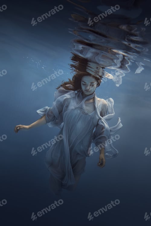 Preview: Portrait Of A Girl In A Blue Dress Under Water