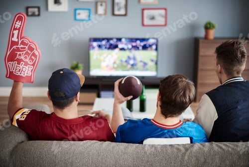 Preview: Three men with American football equipment