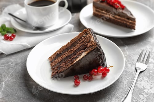 Preview: Slice of tasty chocolate cake with berries served on table