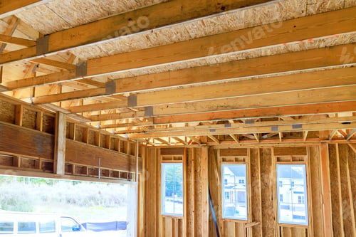 Preview: Construction site interior shows wooden beams framed walls of new home