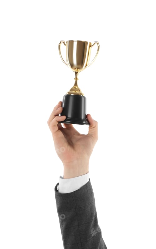 Preview: Man with golden trophy cup on white background, closeup