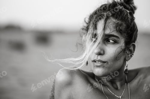 Preview: Black and white portrait photo of a beautiful girl posing outside